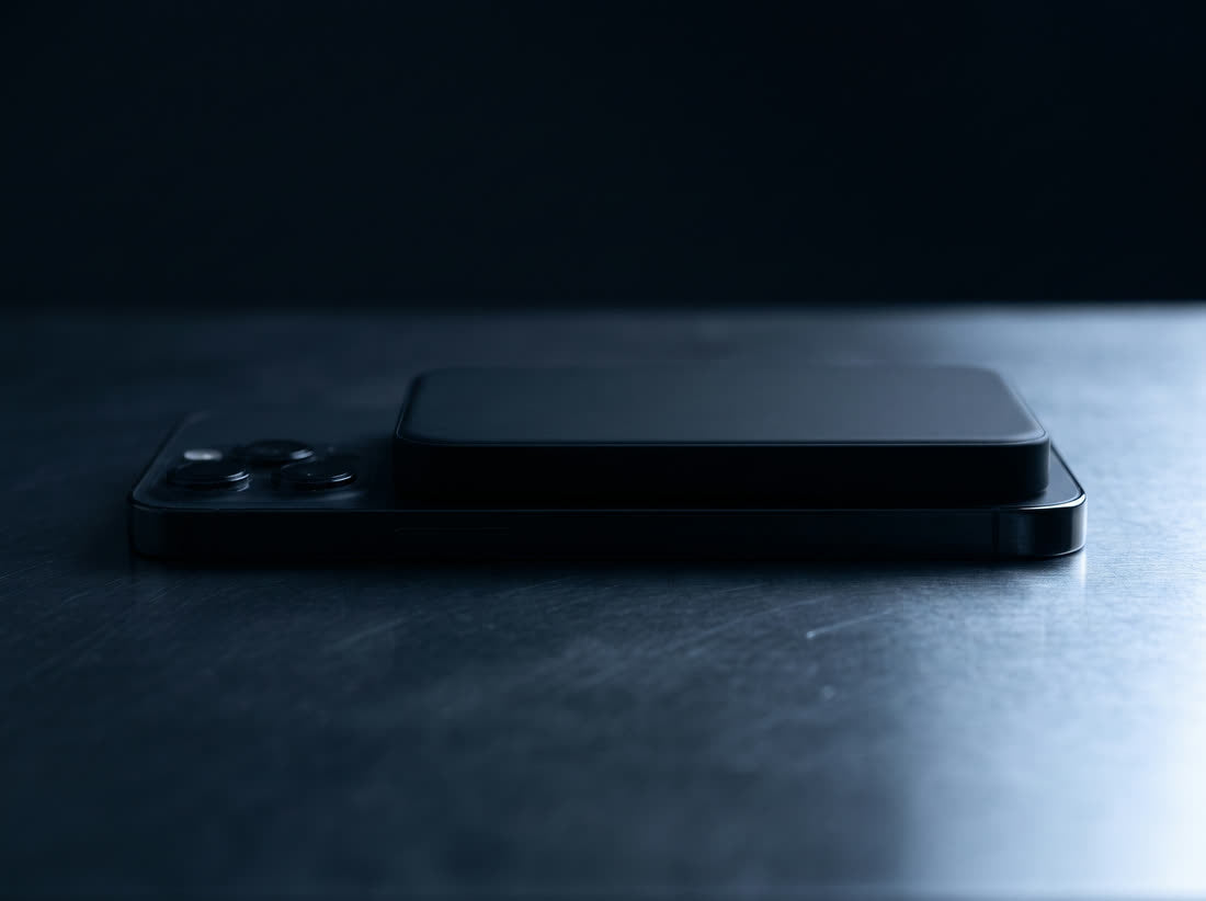 Side view showing how thin the Magnetik power bank is on the back of a phone