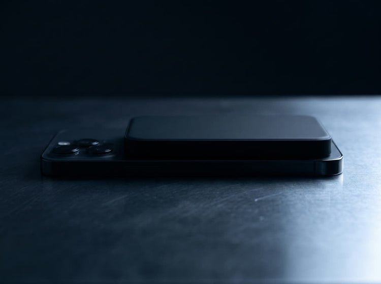 Side view showing how thin the Magnetik power bank is on the back of a phone